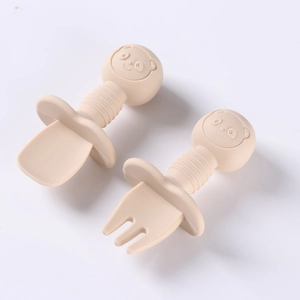 Silicone baby feeding utensils set with wooden handles and bear shaped safety guards
