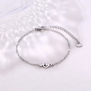 Polished stainless steel music note bracelet with treble clef pendant and adjustable chain