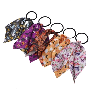 Five-piece Halloween hair scrunchies with streamers featuring ghost pumpkin and skull patterns