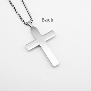 Detail view of the brushed metal back surface on the cross pendant and box chain