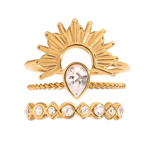 Three-piece gold stainless steel ring set with sunburst, teardrop, and round zircon