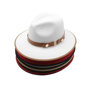 Wool felt fedora hats stacked with brown leather belt and gold metal buckle detail