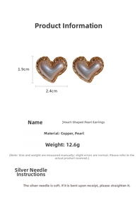 Detail shot showing 1.9cm x 2.4cm dimensions and textured metal of pearl heart earrings