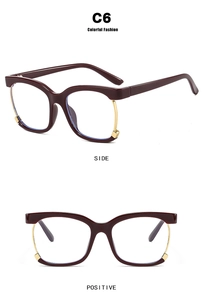 Detail view of square burgundy and gold eyewear frame with anti-blue light clear lenses