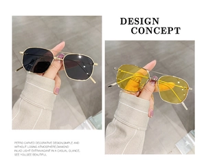 Detail view of aviator sunglasses with gold metal frames and tinted lenses in two colors