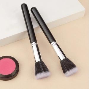Close-up of dual-tone 187 powder brushes with sleek black handles and soft fiber bristles