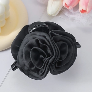 Elegant black satin rose hair claw clip with a glossy fabric finish for women