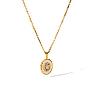 Golden box chain necklace featuring a white shell oval pendant with CZ stone inlay