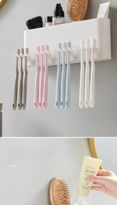 Wall-mounted bathroom organizer with multi-slot toothbrush holder and storage shelf