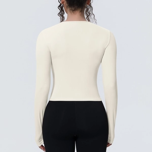 T-shirt de yoga beige à manches longues coupe ajustée avec dos ouvert pour femme