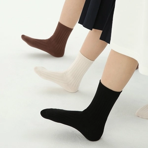 Classic ribbed cotton children's socks in black, beige, and brown, minimalist style