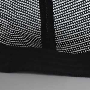 Detailed close-up of the breathable black mesh back and neat stitching on a baseball cap