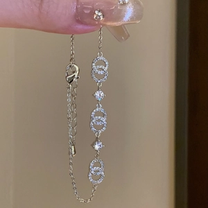 Detailed macro view of 18k gold plated bracelet with sparkling interlocking zircon circles