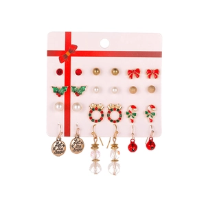Christmas earring set with festive Santa and tree motifs on white display card
