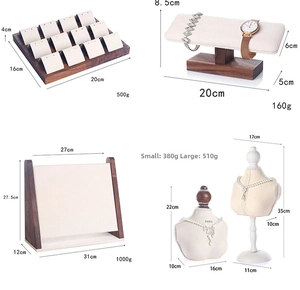 Detail view of 4-piece walnut jewelry stand set with necklace and earring displays