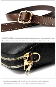 Detail of black litchi leather bag showing gold hardware and adjustable brown strap