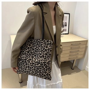 Leopard print tote bag detail showing large capacity and soft canvas material texture