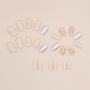 Short Aurora nude nails set featuring white daisy smiley face patterns and pearl finish