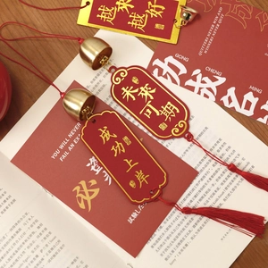 Traditional brass bells with red tassels and gold embossed charms for DIY wind chimes
