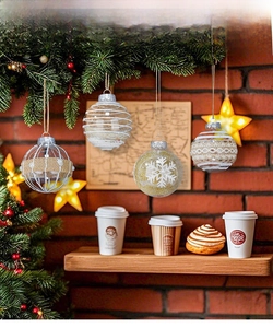 Close-up of assorted Christmas ball ornaments with festive patterns on a rustic wooden shelf