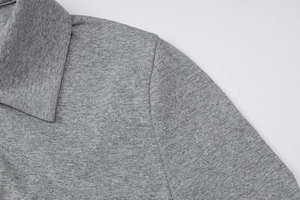 Close-up of the polo collar and grey heather knit fabric texture on a slim-fit shirt