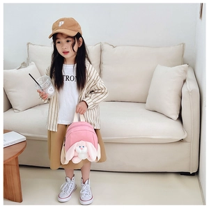 Pink toddler backpack featuring a cute 3D plush bunny with long ears and soft cream straps
