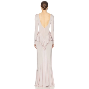 Detail view of pink backless dress with elegant ruffled back and long sleeves design
