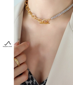 Detail of gold-plated stainless steel chain necklace with zircon stones and OT buckle