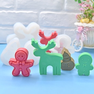 Silicone Christmas molds for baking featuring gingerbread man, reindeer and snowman shapes