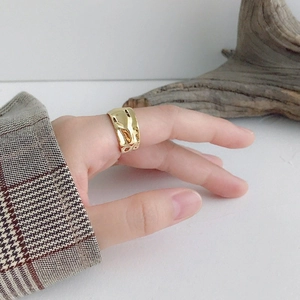 Irregular textured wide gold band ring with geometric crinkle design for women