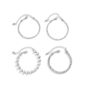 Detail of four silver-tone tennis bracelets with rhinestones and lobster clasps