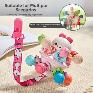 Detail of baby rattle ball with pink cat strap and suction cup for high chairs