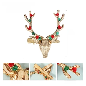 Detail of Christmas reindeer hair clip featuring copper wire and acrylic crystal beads
