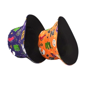 Reversible Halloween bucket hats in purple and orange with spooky ghost and web prints