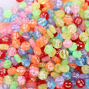 Close-up of colorful round acrylic smiley face beads for DIY jewelry making kits