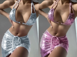 Detail of metallic snake print bikini and skirt set with golden ring and drawstring