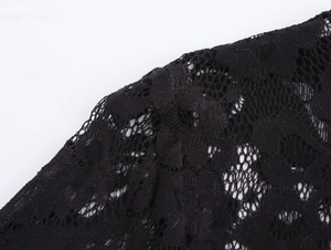 Close-up of intricate black floral lace fabric with high-quality textured patterns