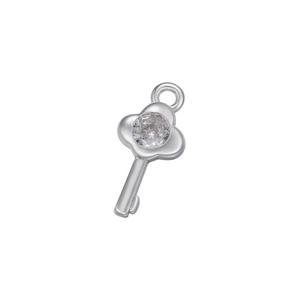 Macro shot of silver key pendant with micro-pave zircon stone inlay for DIY jewelry