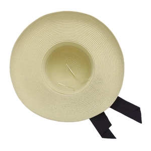 Women's beige straw sun hat with black ribbon bow, wide brim woven lampshade design