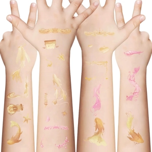 Colorful koi carp and sea shell temporary tattoos applied on arms for party DIY