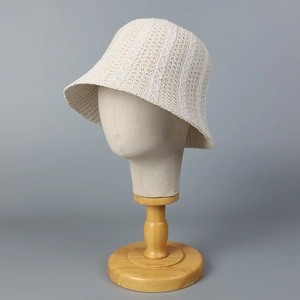 Chic cream knitted bucket hat for women on display stand featuring vertical geometric patterns