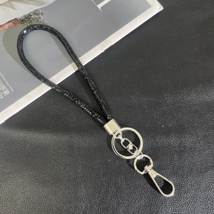 Detail of luxury black rhinestone wristlet strap with silver metal swivel lobster clasp