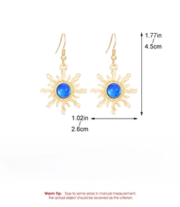Detail view of golden sun pendant with blue stone inlay and precise dimension markings