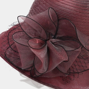Elegant burgundy organza sun hat with mesh veil and oversized floral petal detail