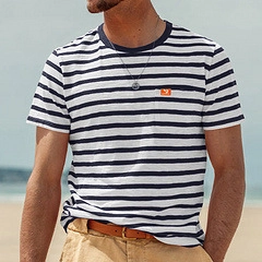 Men's summer casual crewneck striped T-shirt with pocket shown in outdoor beach setting
