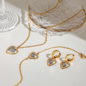 Two-tone gold and silver heart jewelry set with necklace bracelet and earrings