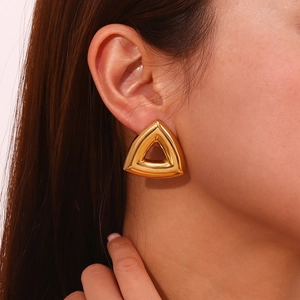 18K gold plated hollow geometric triangle stud earrings worn by a model in a close-up view