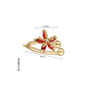 Detail view of gold flower ear cuff showing 0.7cm red petals and 0.4g lightweight design