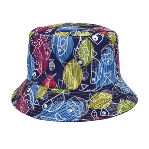 Detailed view of the navy blue sun hat featuring colorful fish patterns and precise stitching