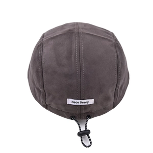 Back view of a minimalist gray suede baseball cap with adjustable drawstring toggle detail.